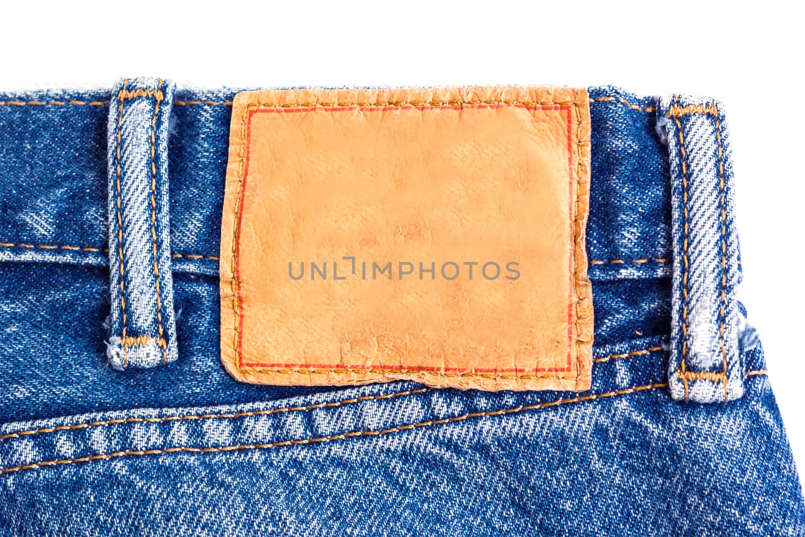denim jeans background with blank leather label of jeans fashion design