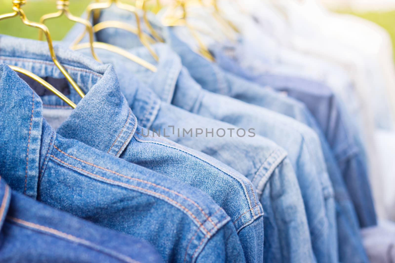 Jeans shirt sold in the market, close-up of jeans jacket 