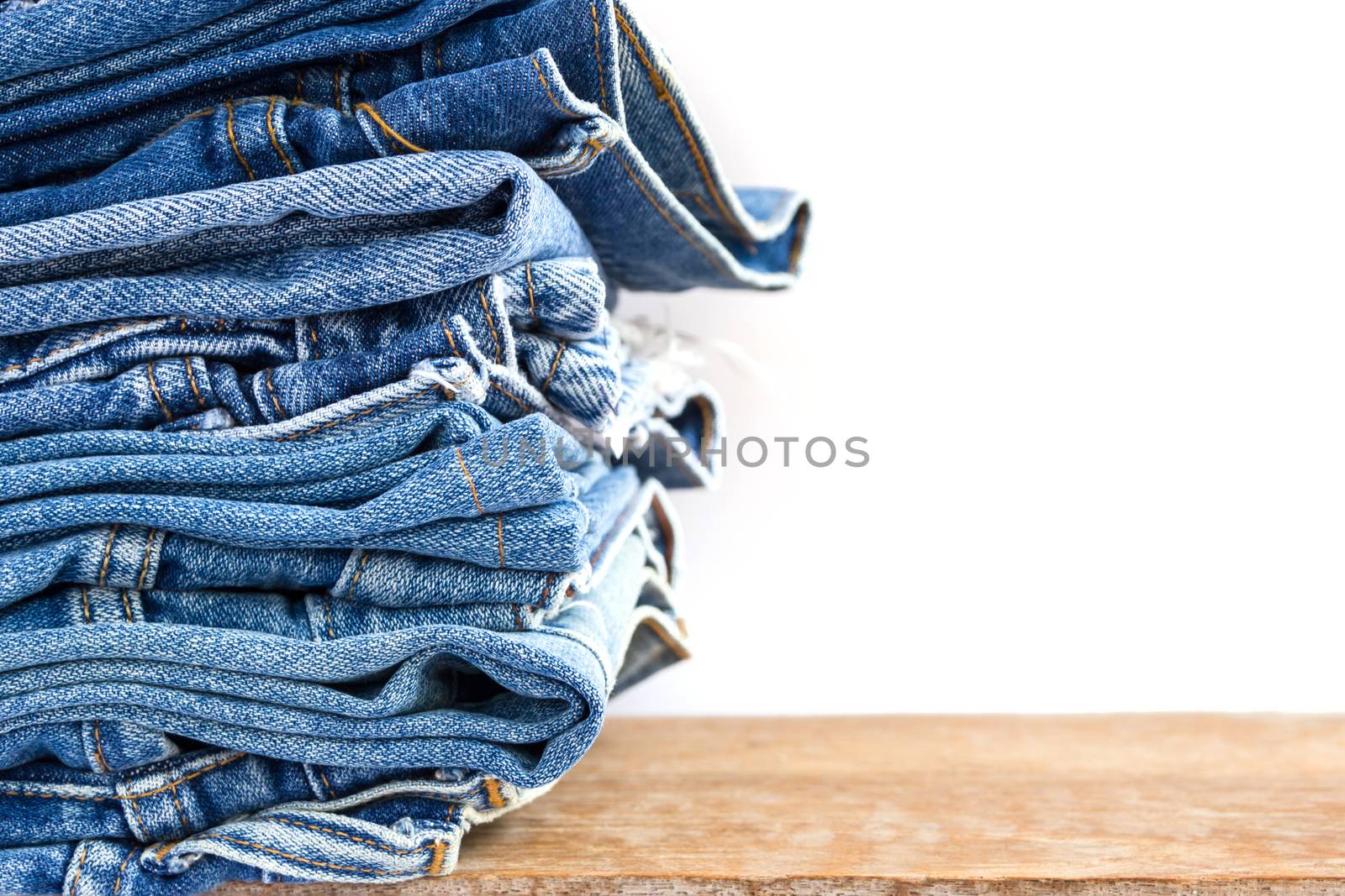 lot of denim blue jean texture is the classic indigo fashion. close-up of denim blue jeans, concept for fashion