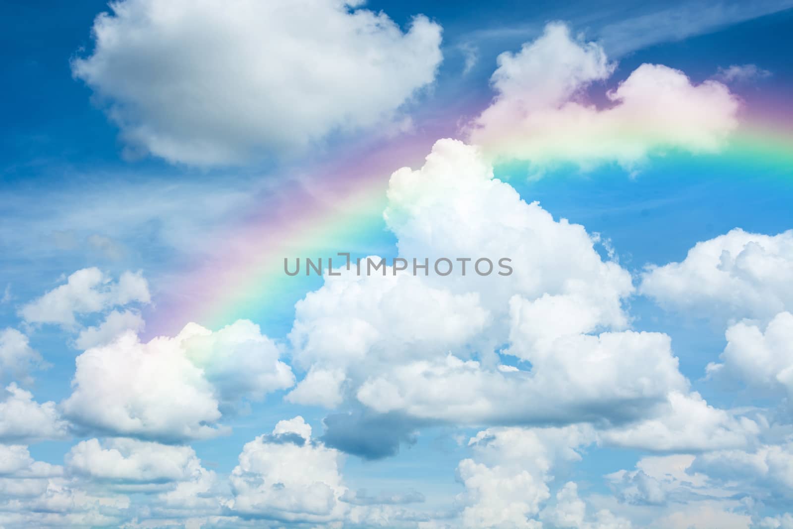 beautiful classic rainbow across in the blue sky after the rain by rakoptonLPN