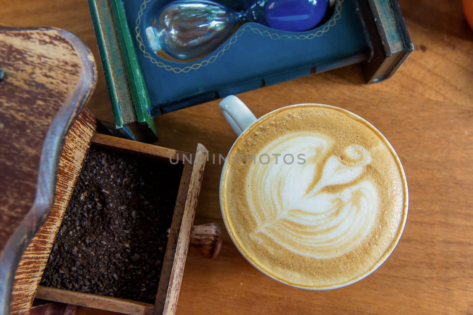 latte art coffee or cappuccino on wooden table background.