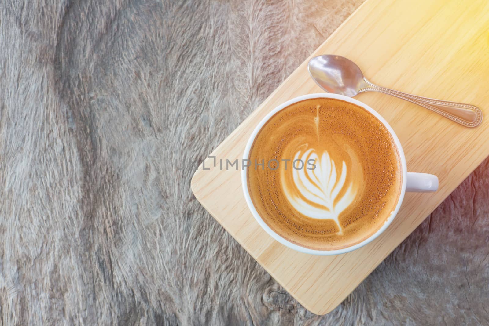 latte art coffee or cappuccino on wooden table background.
