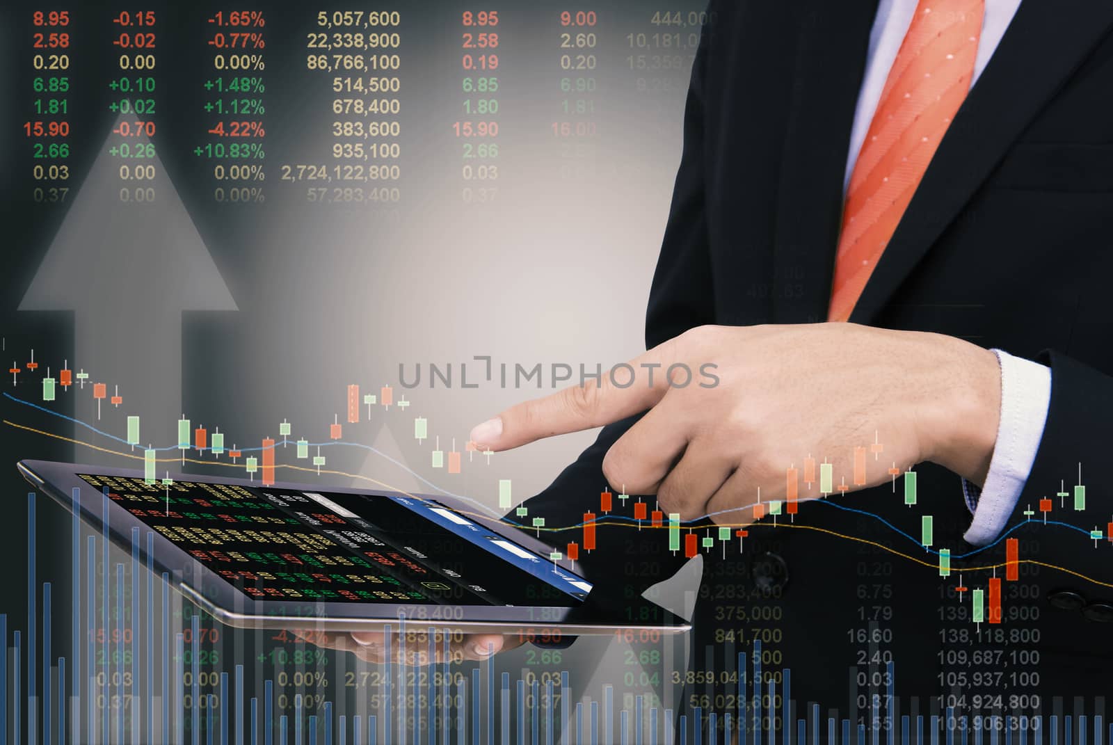 business man Trading concept using the tablet with financial graph on cityscape background, Double exposure style.