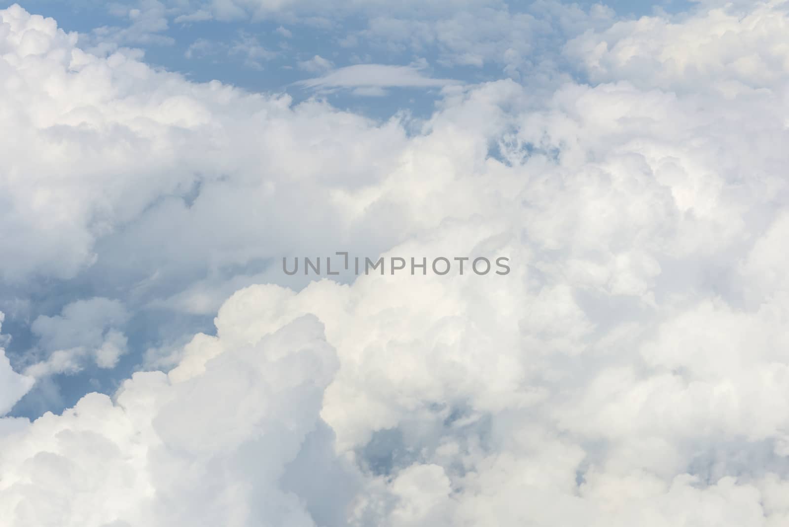 Blue sky and Clouds as seen through window of aircraft by casanowe