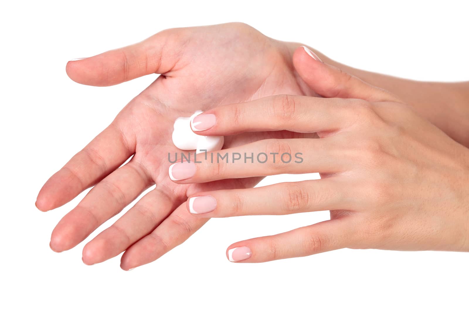 Closeup shot of beautiful woman's hands with cream, isolated on white background