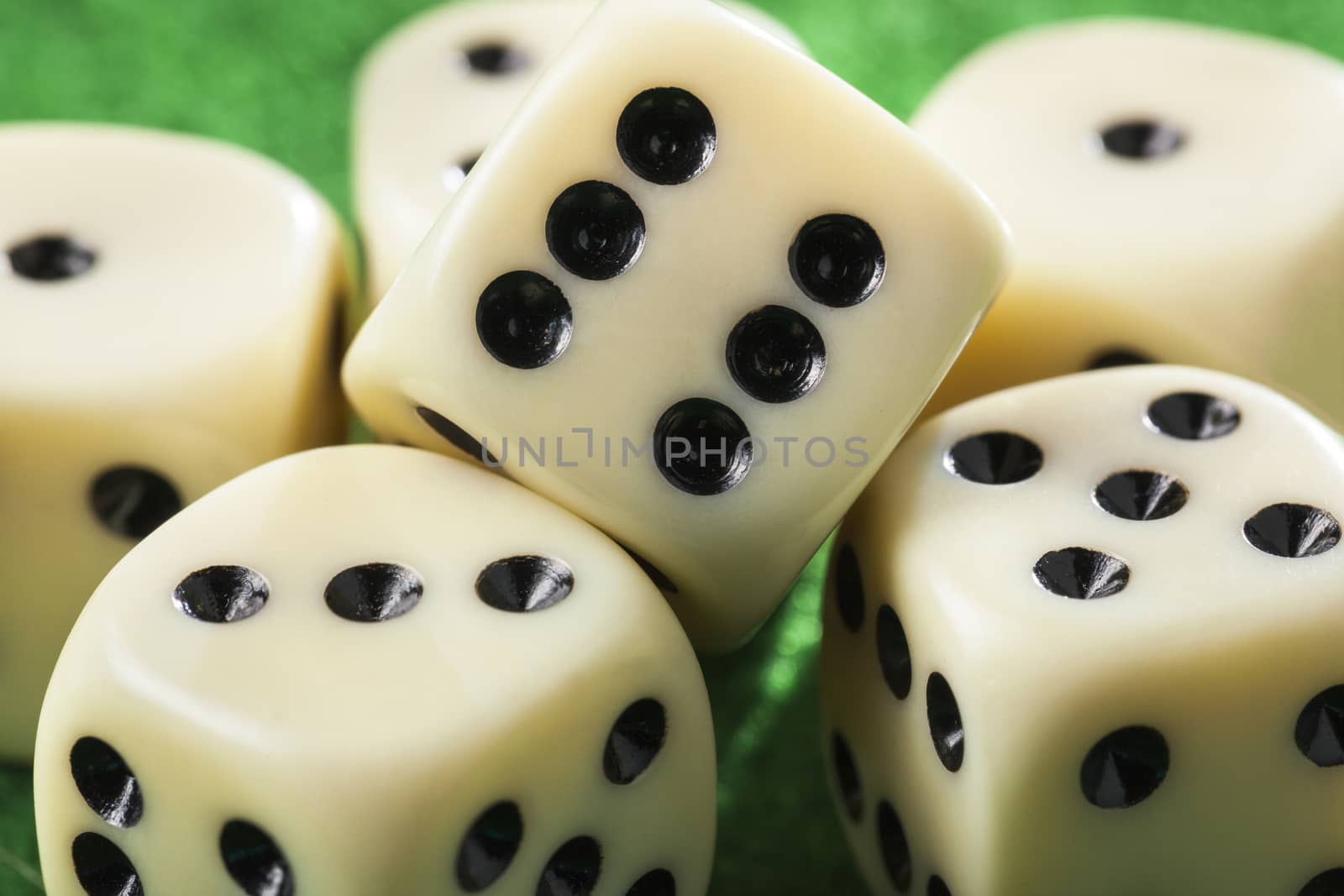 Close up of six dices on a green table by kievith
