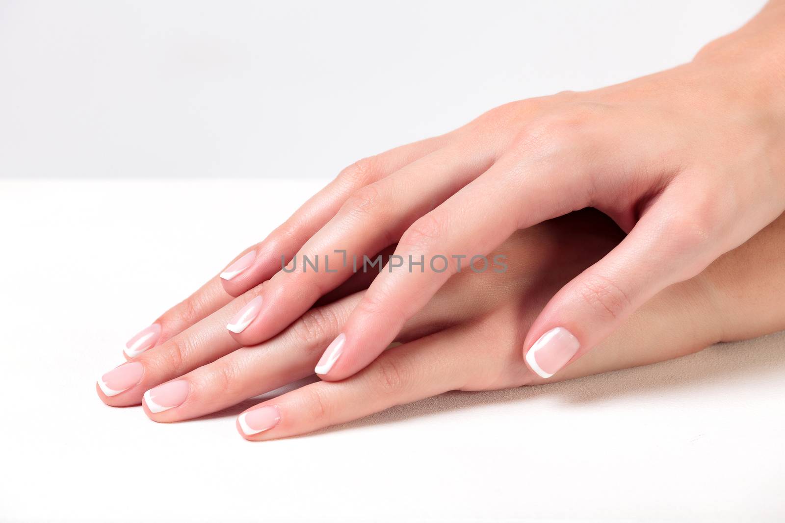 Closeup shot of beautiful woman's hands with clear and healthy s by Nobilior