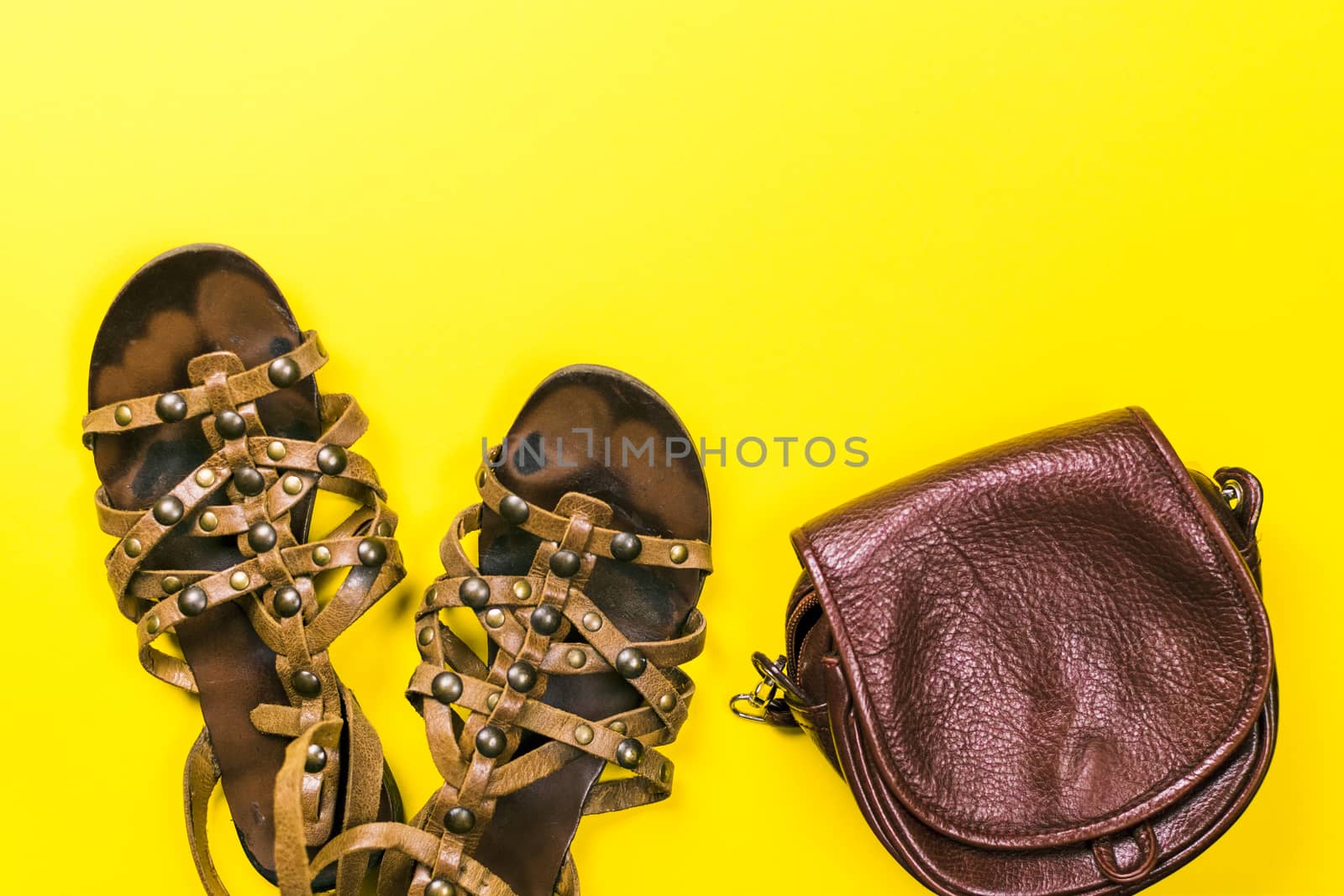 Sandals, bag on a colored background
