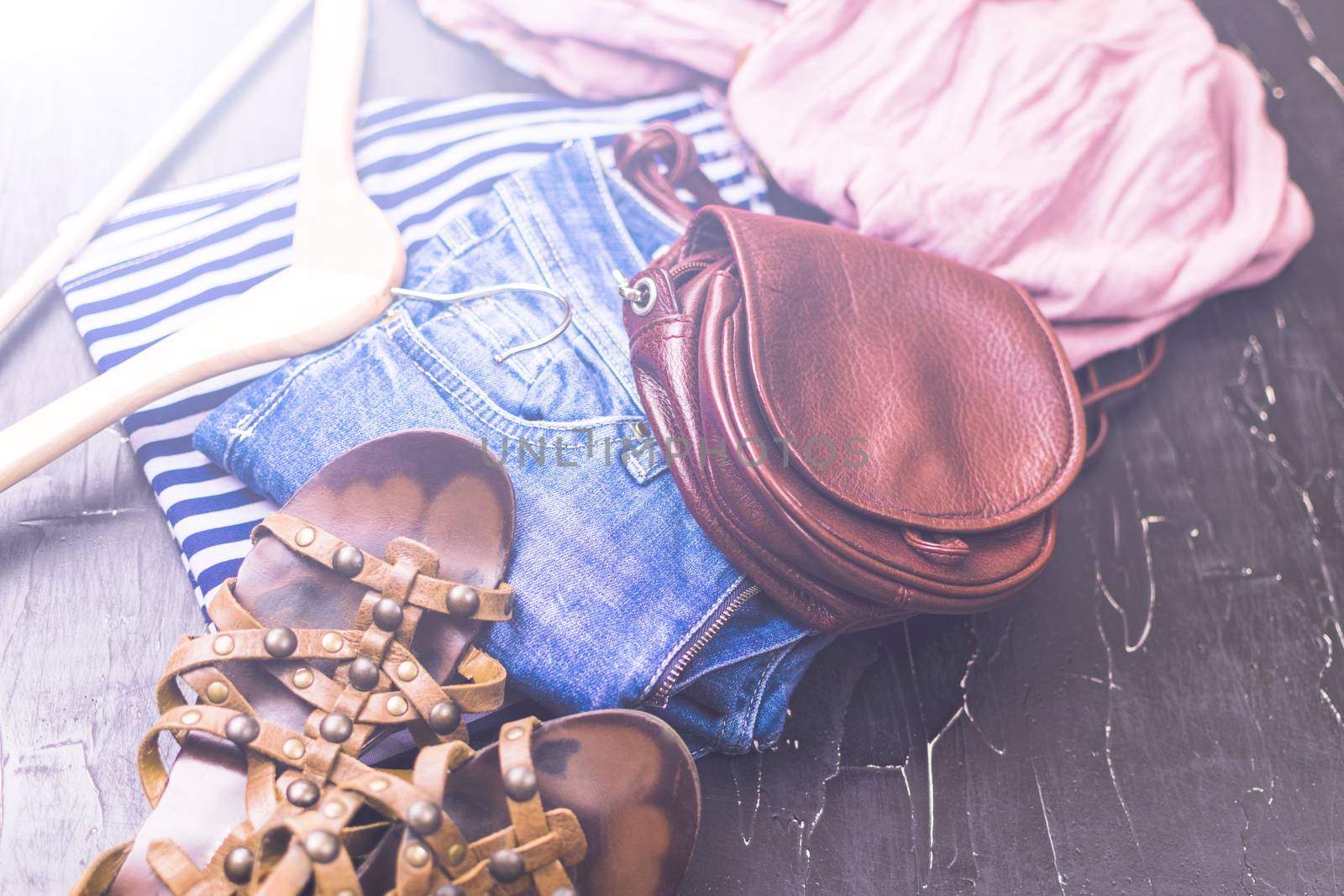 Women's clothing and shoes on a dark background