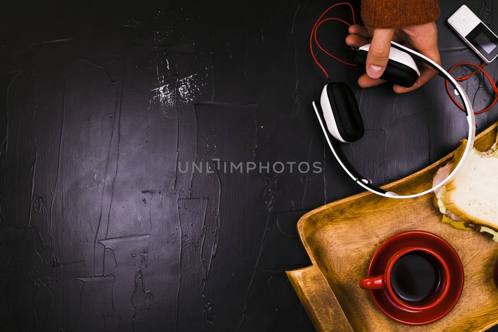A man listens to music during the break for lunch.