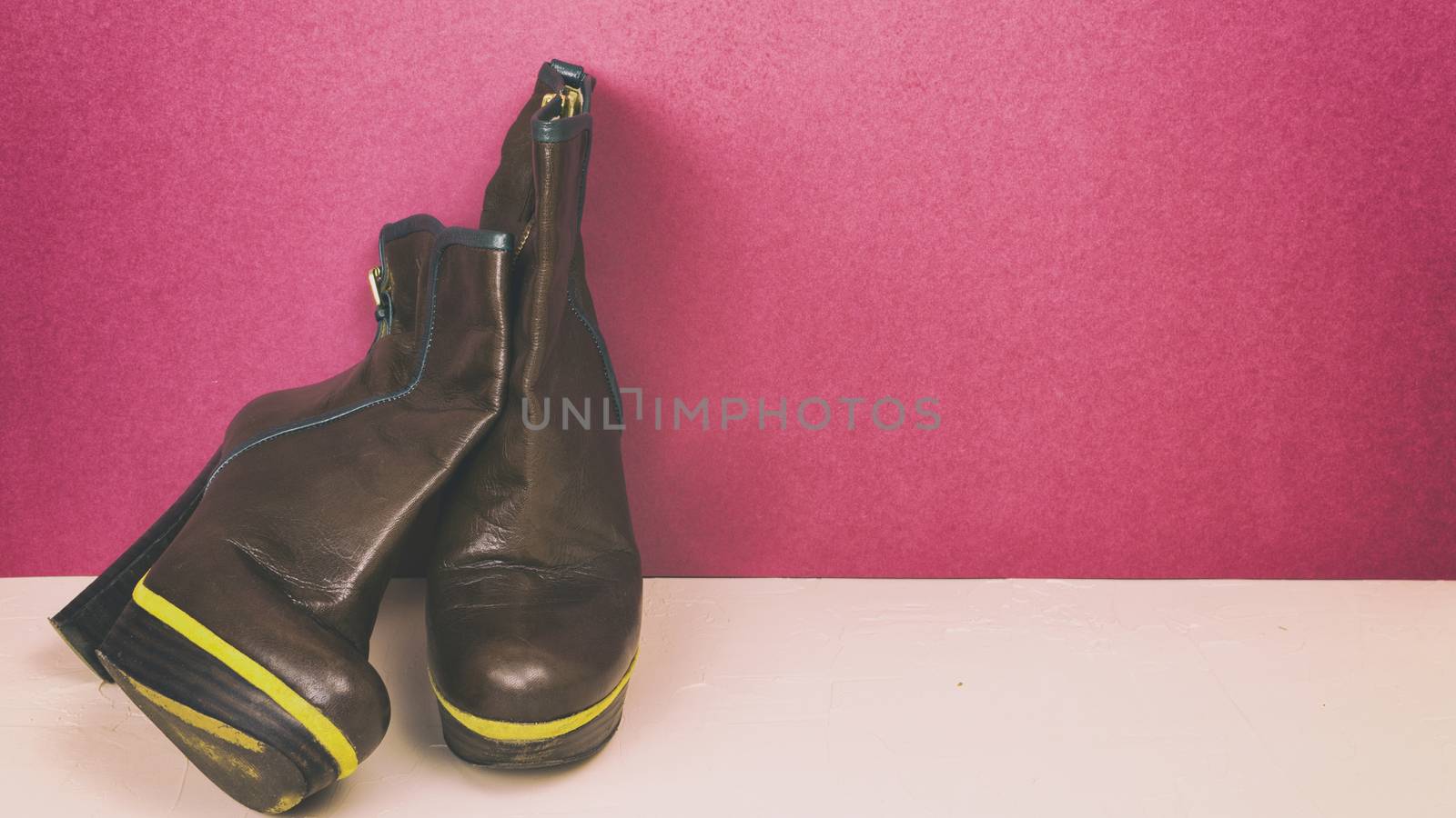 Ankle boots on a colored background