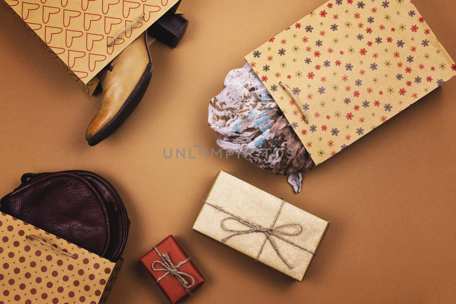 Gifts in packages on a brown background