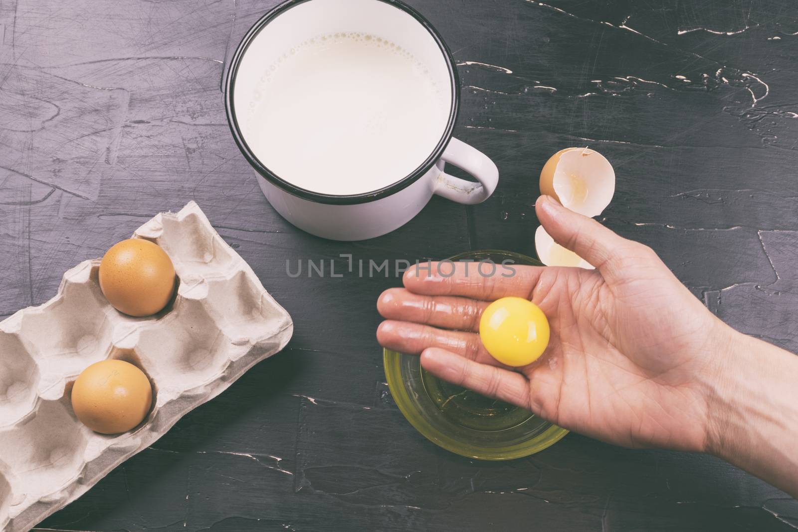 A man prepares eggnog