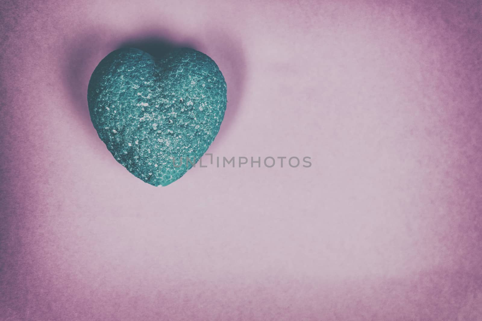 Blue heart on a pink background. Vintage.