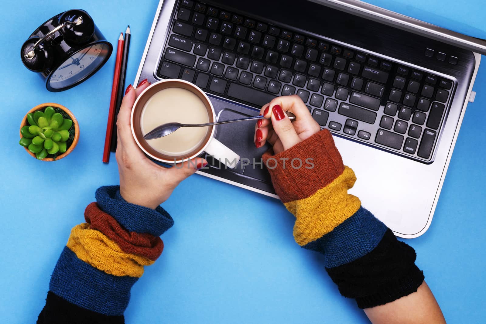 The girl works at the computer. Colored background. The concept of freelancing.