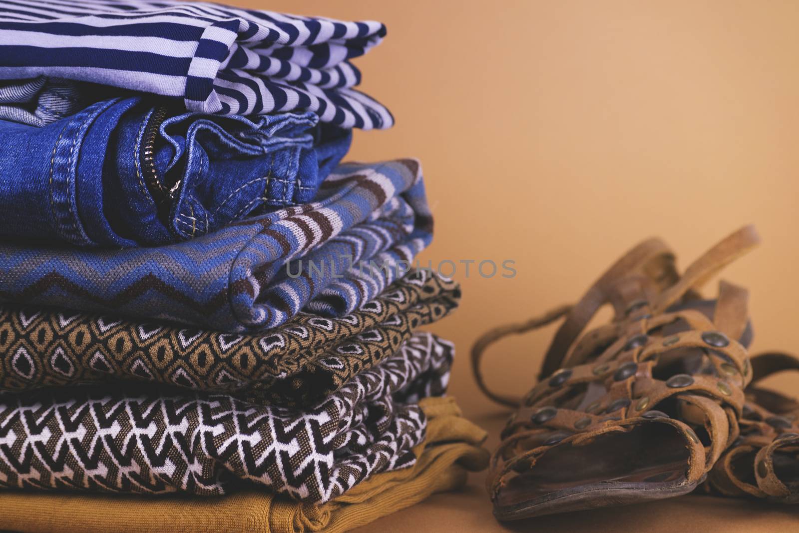 Women's shoes, clothing and accessories on a colored background