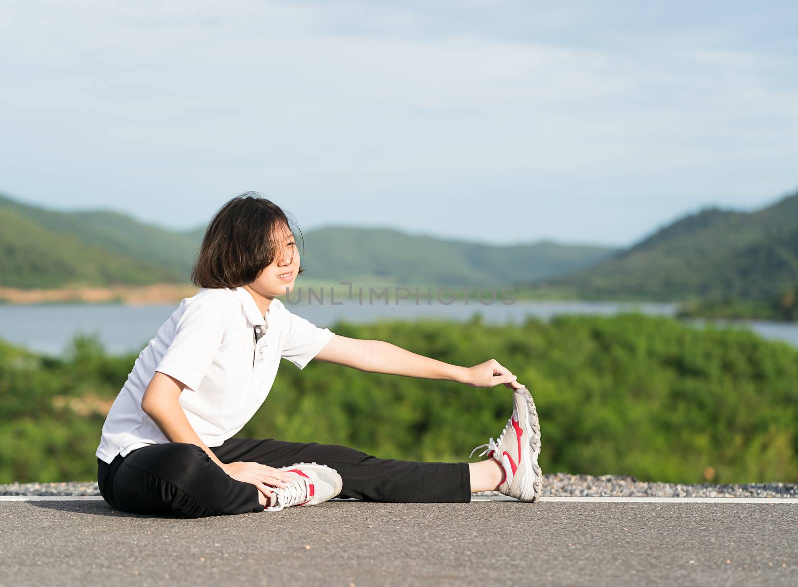 Woman preparing for jogging outdoor by stoonn