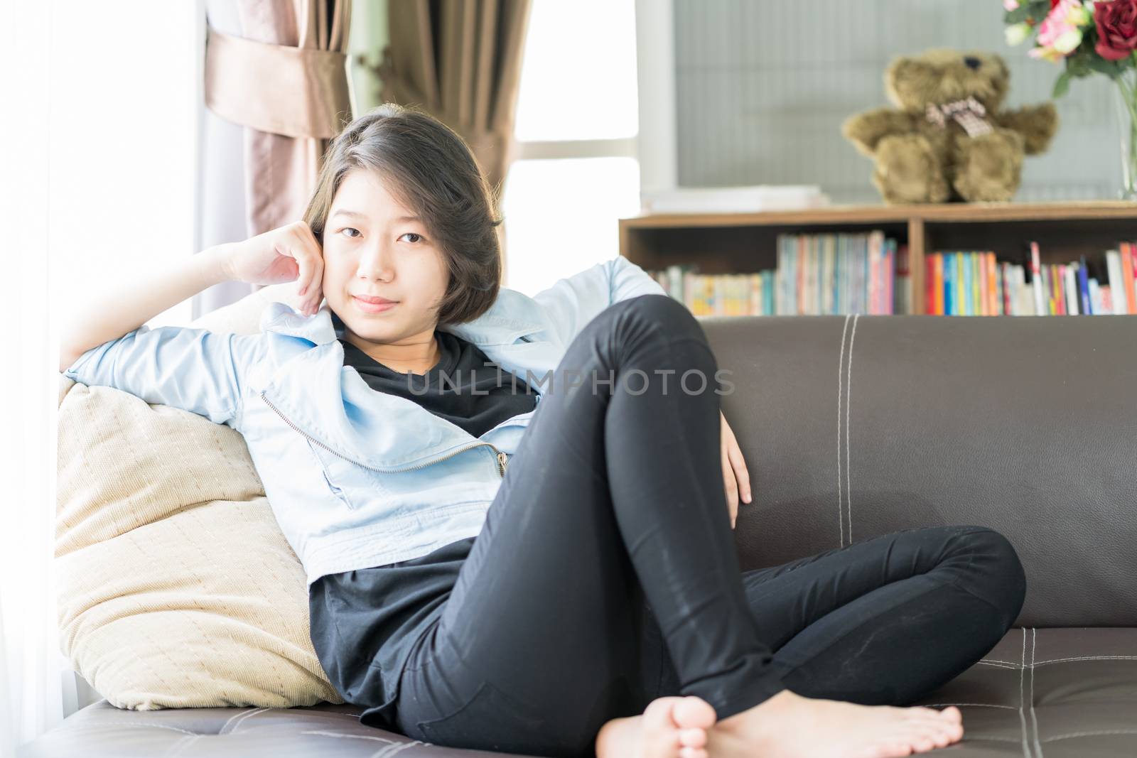 Woman short hair relaxation in living room by stoonn