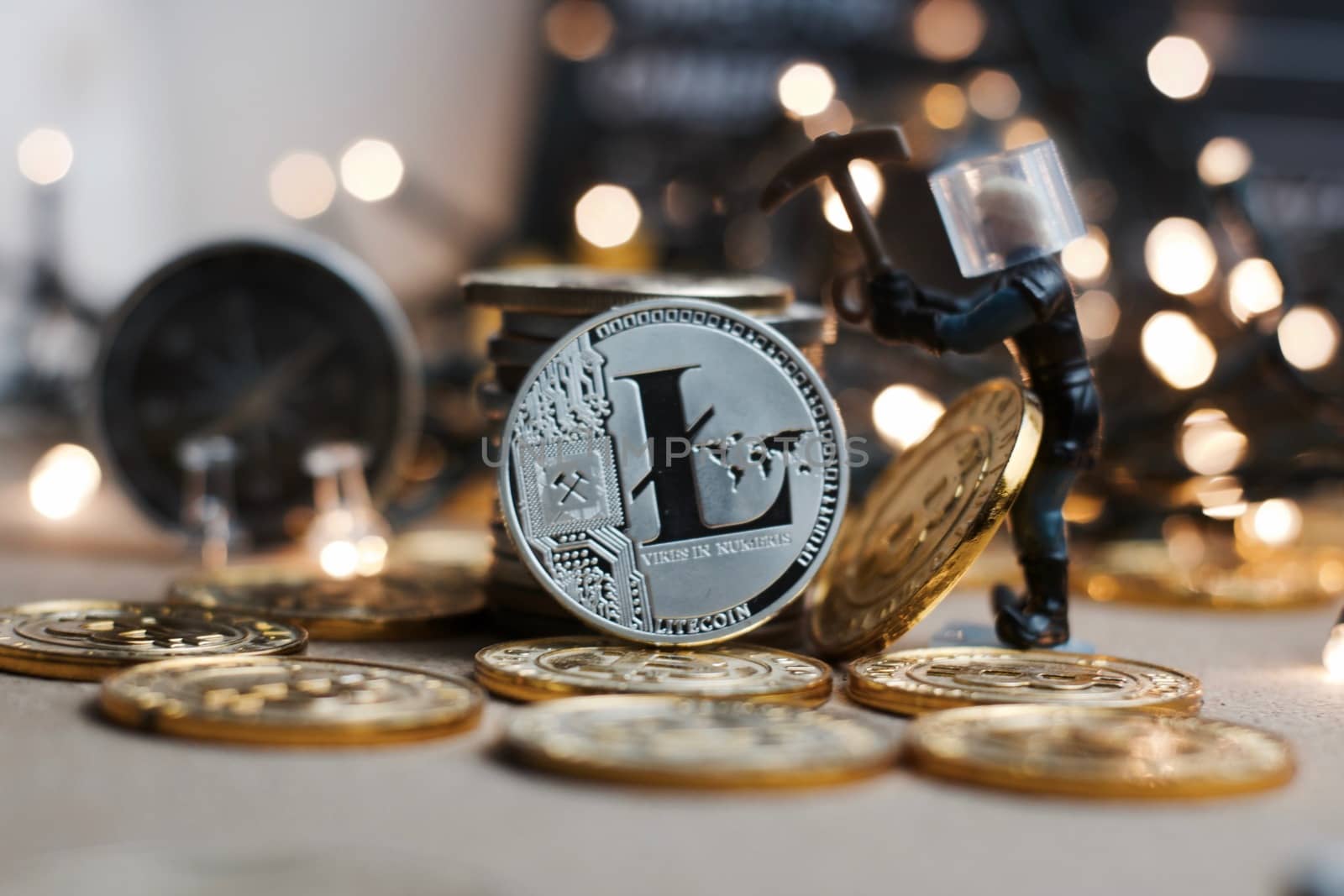 Crypto currency physical metal Litecoin coin. Christmas mining concept.