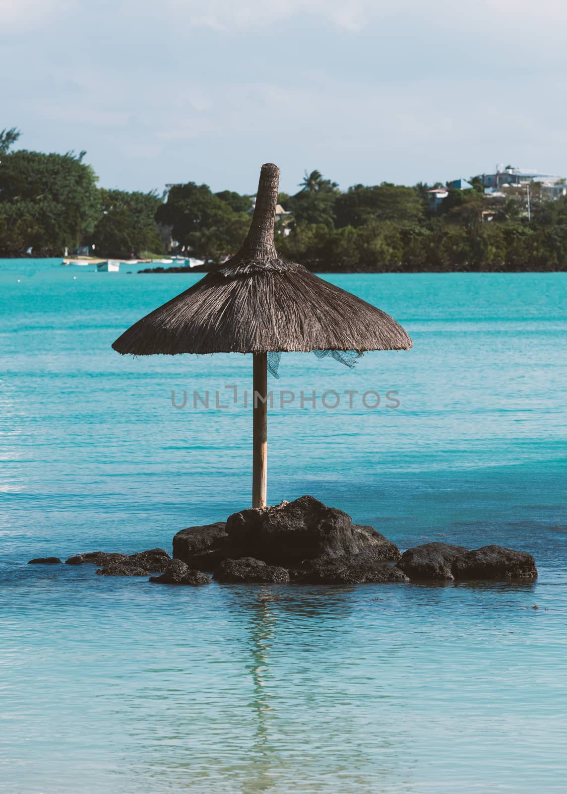 Parasol alone in the water by Robertobinetti70