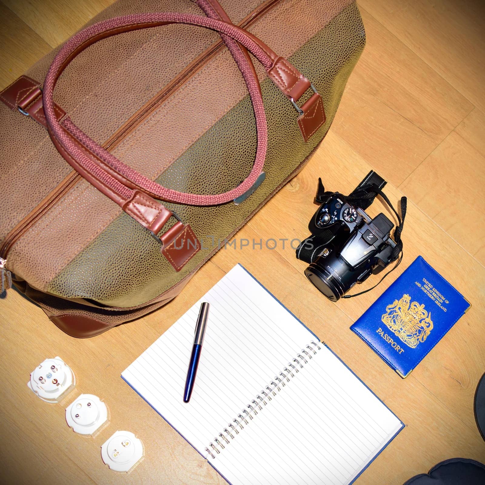 Flat lay of a travel concept, depicting a globe and deciding where to go next.  Creating a bucket list