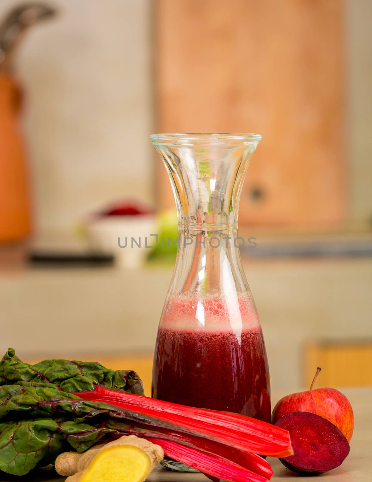 Glass jar of red juice, a detox beverage.  