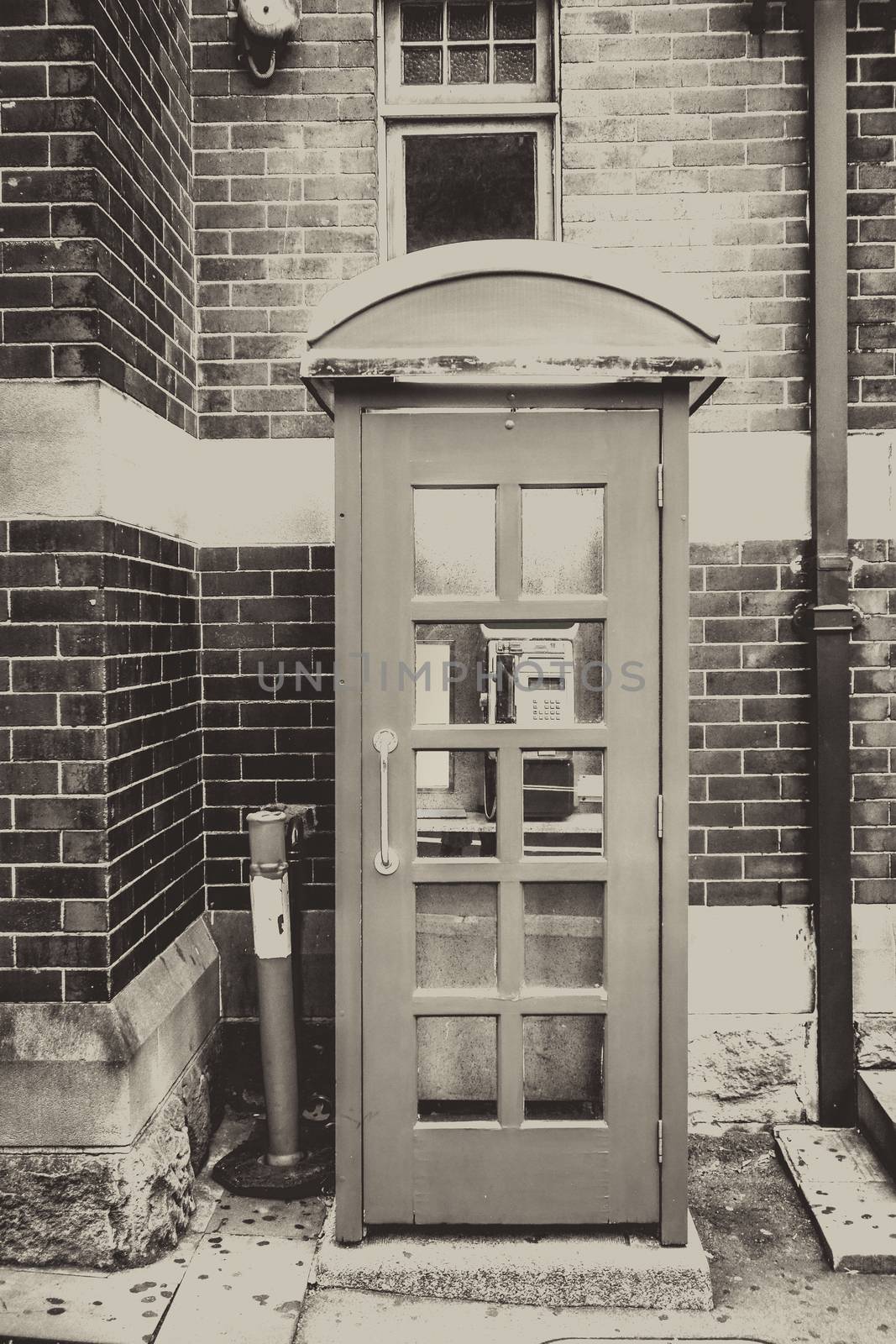 Vintage UK red phone booth, black and white picture