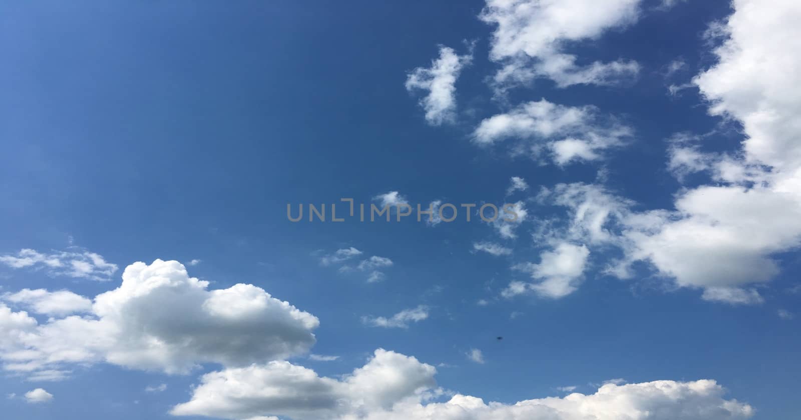 Beautiful blue sky with clouds background. Sky clouds .Sky with clouds weather nature cloud blue. by titco