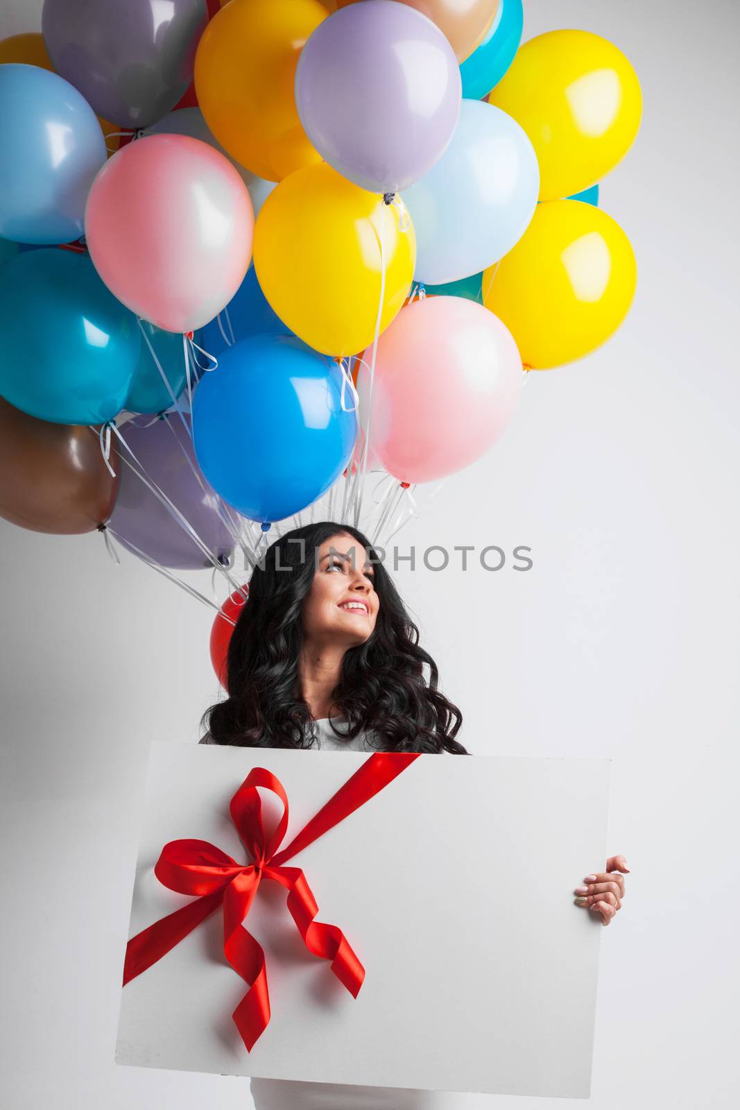 Woman with balloons and gift by Yellowj