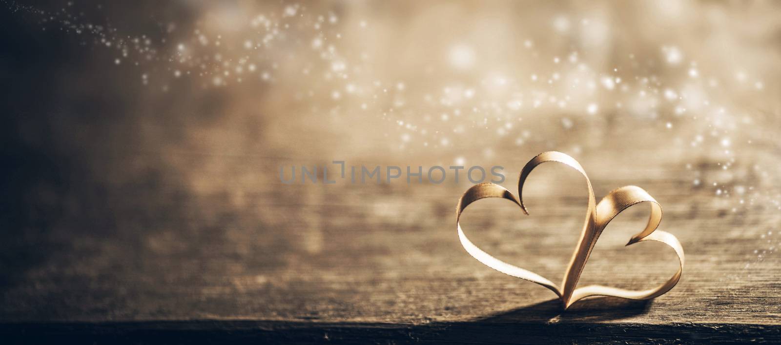 Two ribbon magic hearts on wooden backround, Valentine day concept