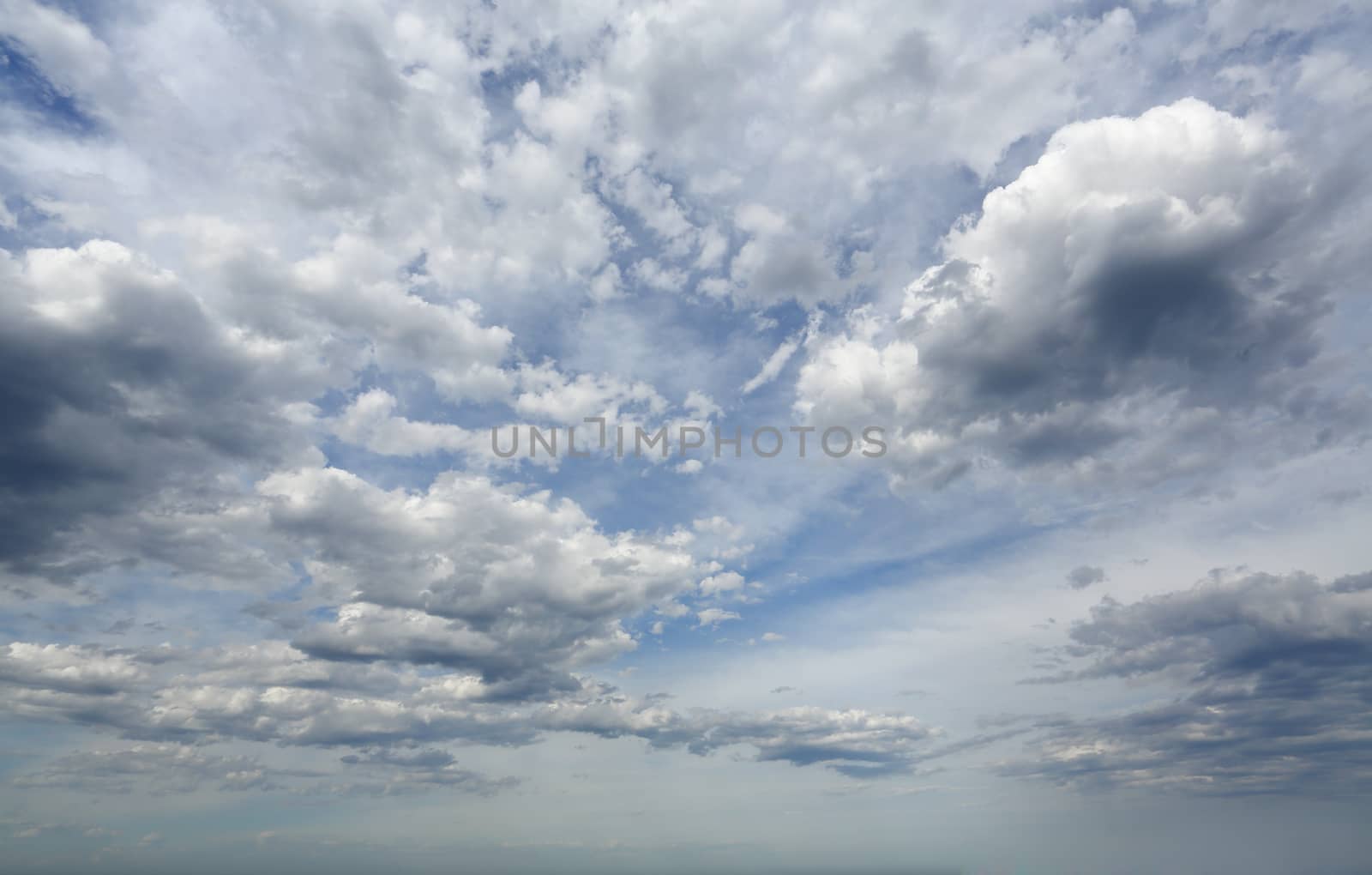 Amazing sheer high cloud mixed with heavier grey clouds moving across the sky in summer.  Australia