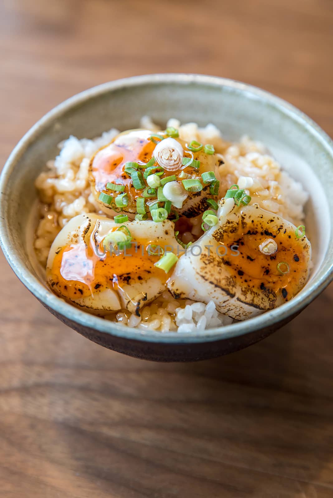 Hotate on rice with uni sauce, Grilled fried scallop rice, gourmet japanese cuisine.