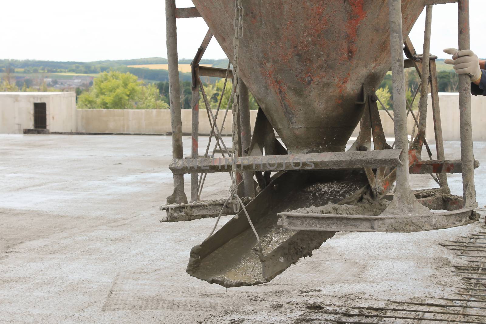 workers at the construction site poured concrete floor by nolimit046