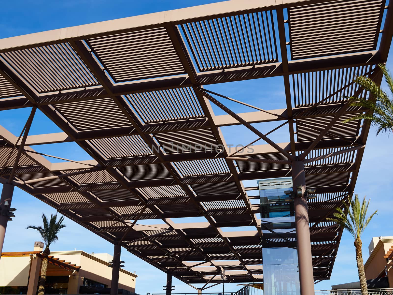 Modern design pergola arbor made wood and metal with clear blue summer sky background