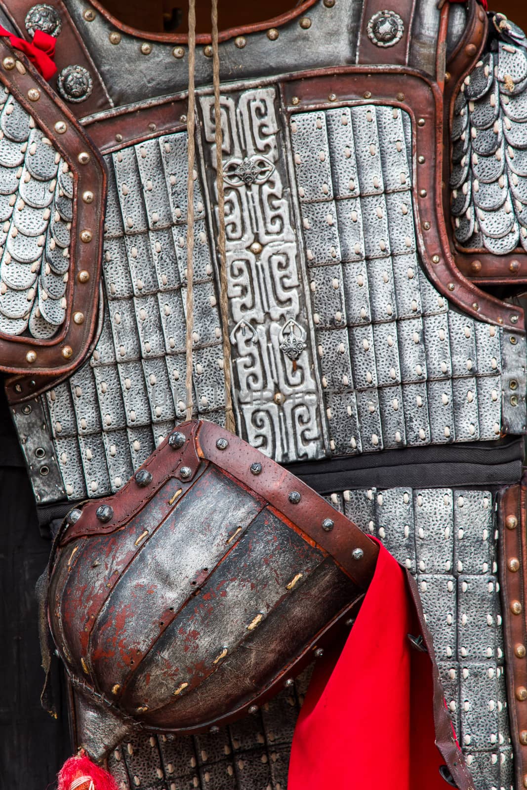 Close up of a rusting ancient asian suit of armour.