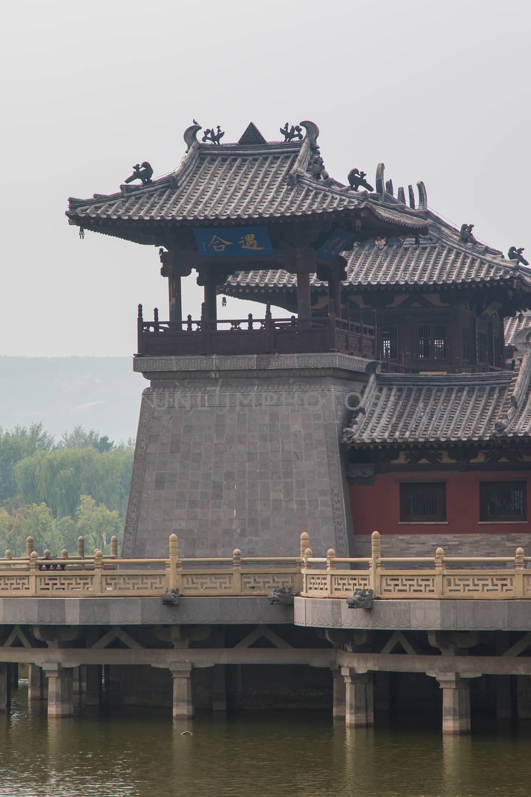 Centuries old, ancient chinese watchtower on a lake