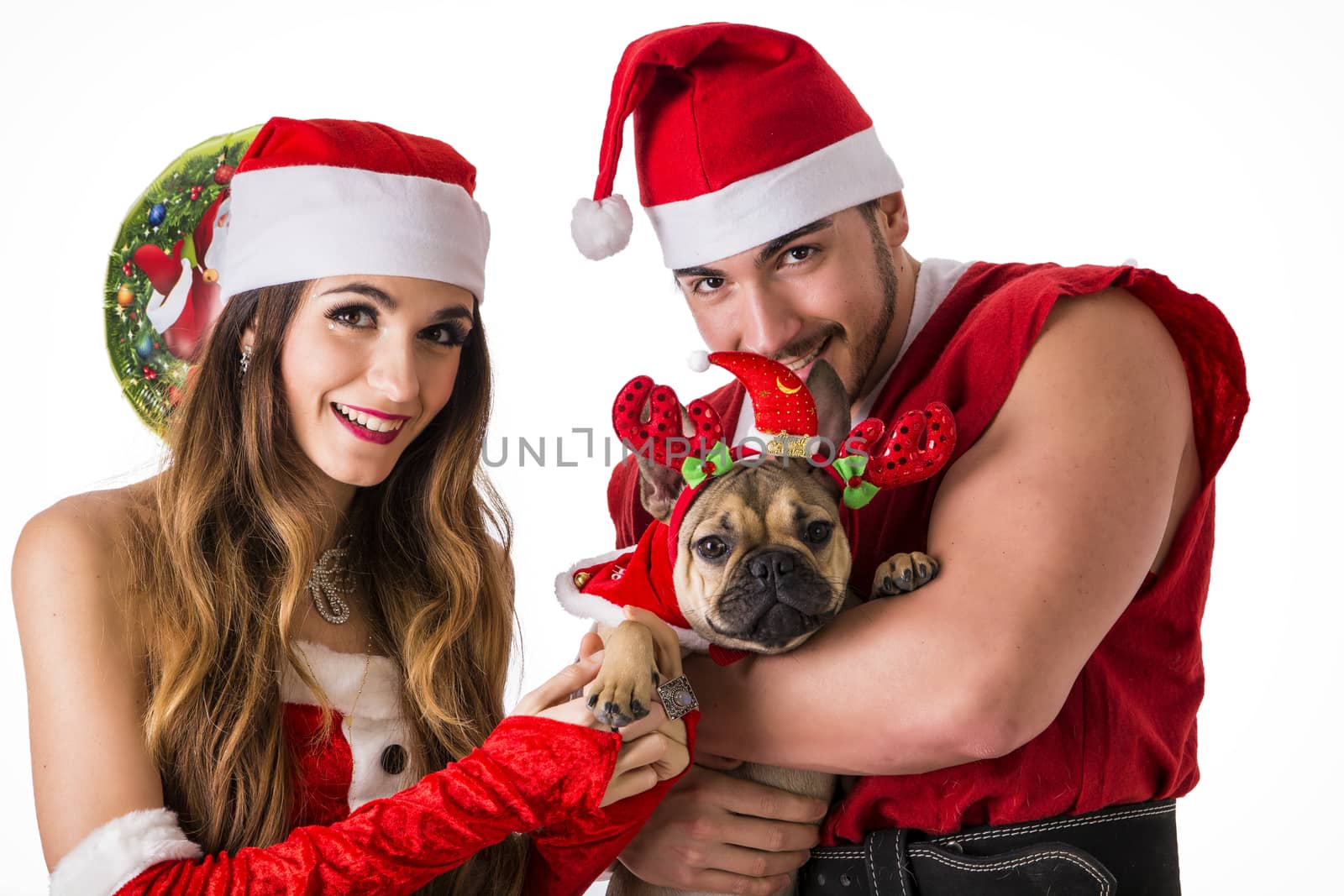 Good looking couple in Santa Claus hat with Christmas gift by artofphoto