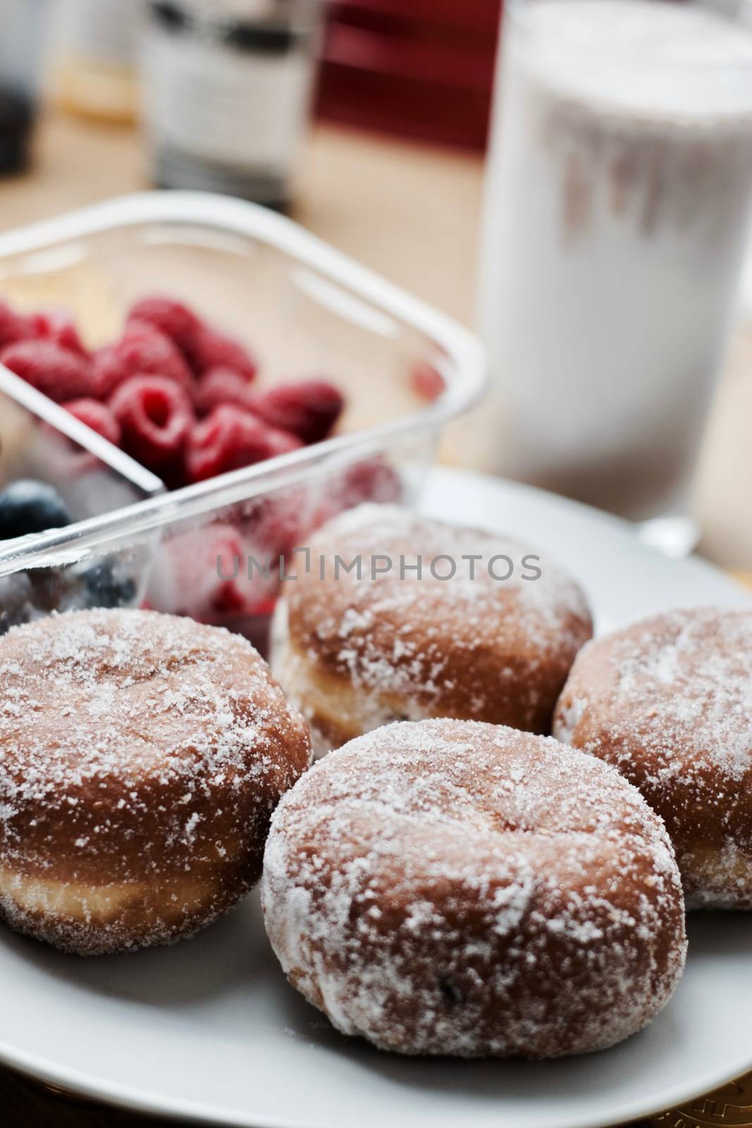 Delicious doughnuts on the white plate. Sweet fresh food concept.