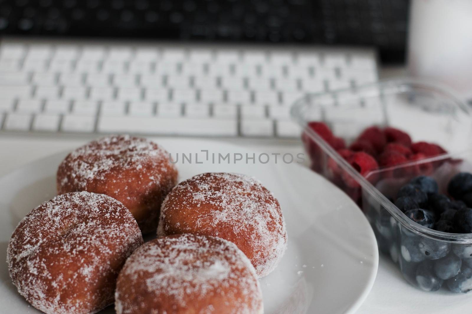 Delicious doughnuts on the white plate. Sweet fresh food concept.