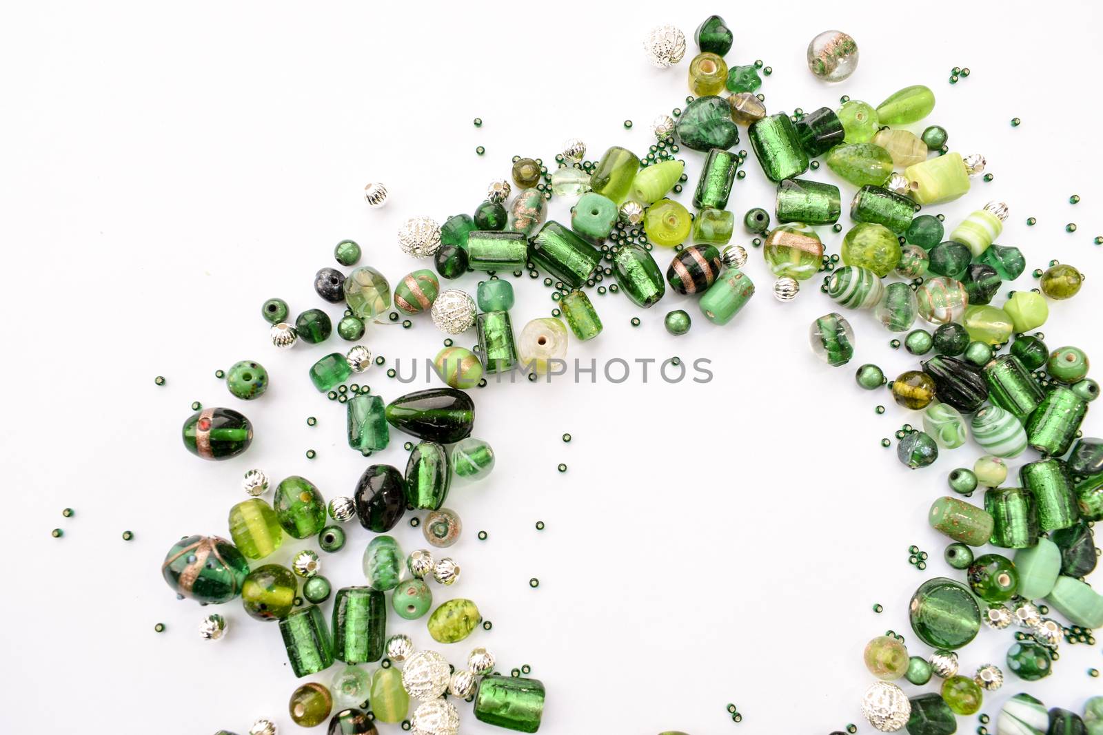 collection of green glass beads shaped into off center garland