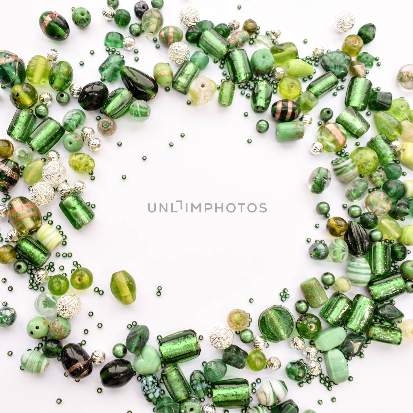 collection of green glass beads shaped into off center garland