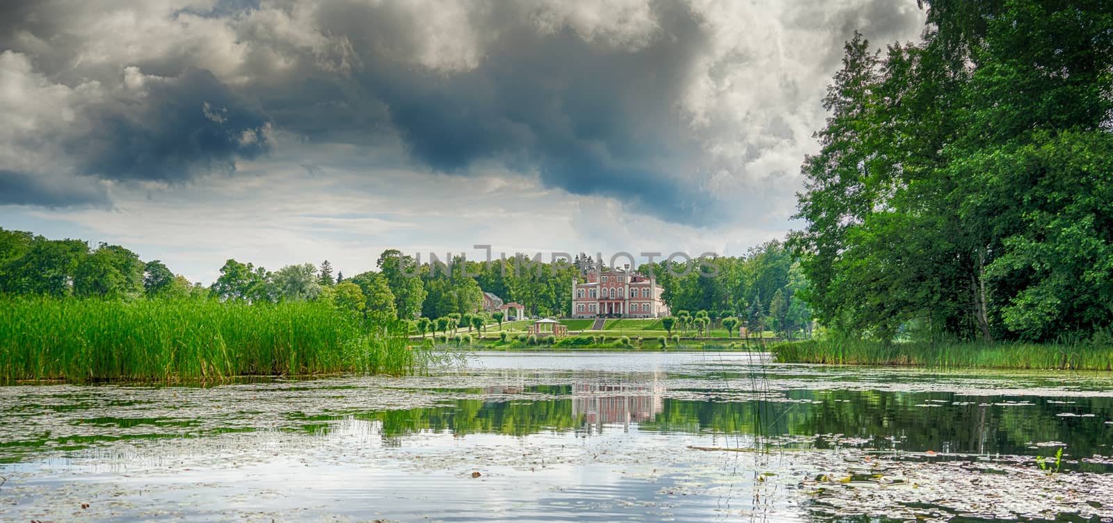 Reflections in a lake with sky and trees by javax