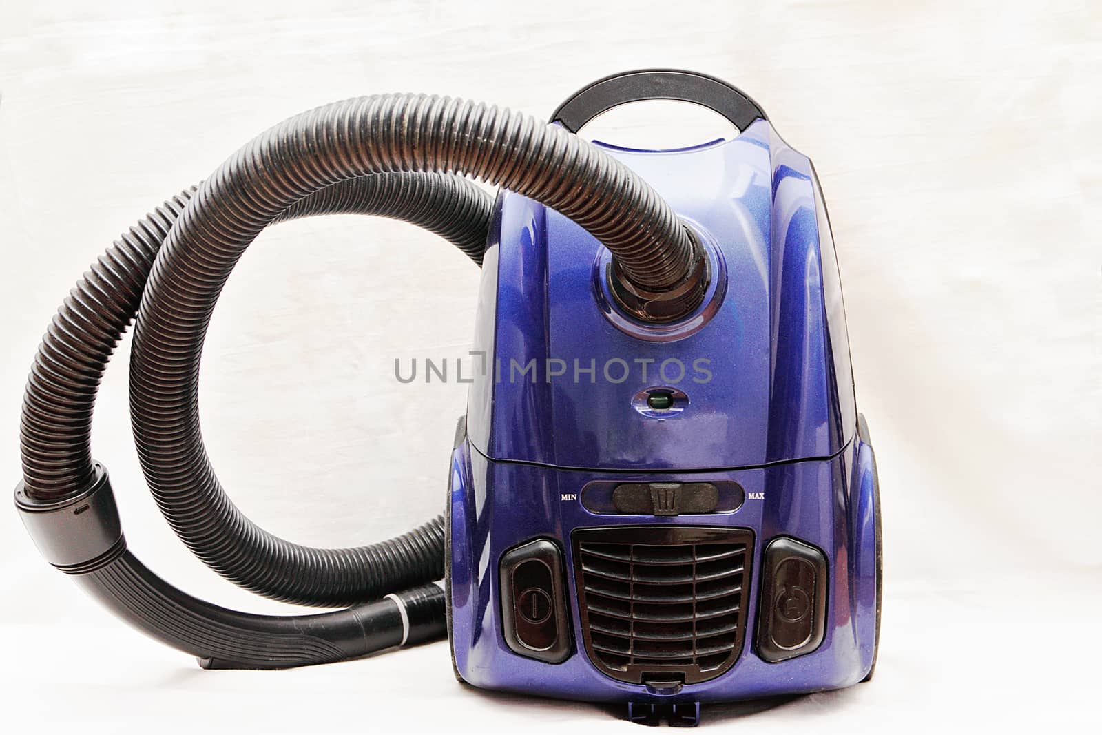 Home vacuum cleaner with hose isolated white background.
