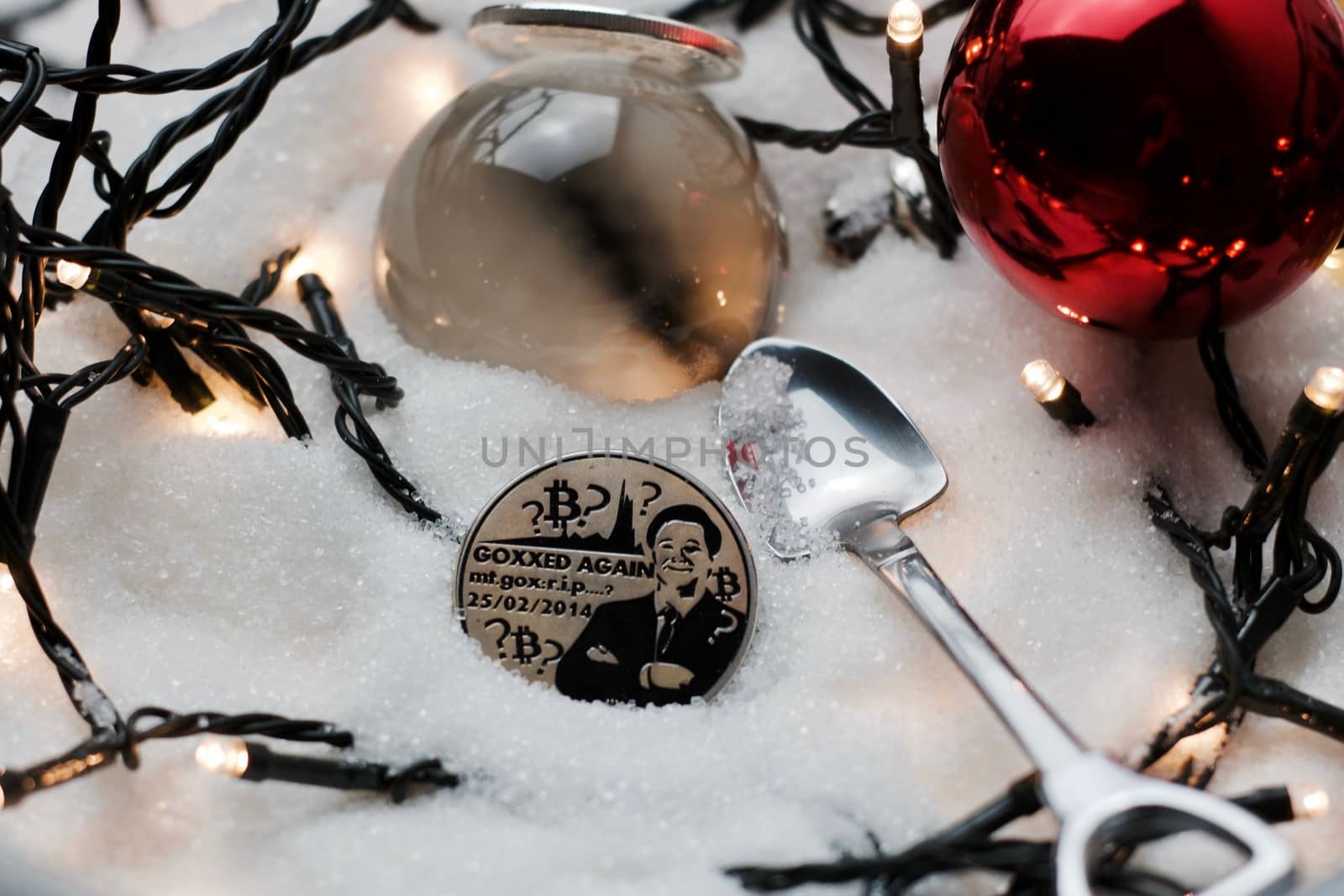 Digital currency physical metal bitcoin coin. Crypto currency christmas snow composition.