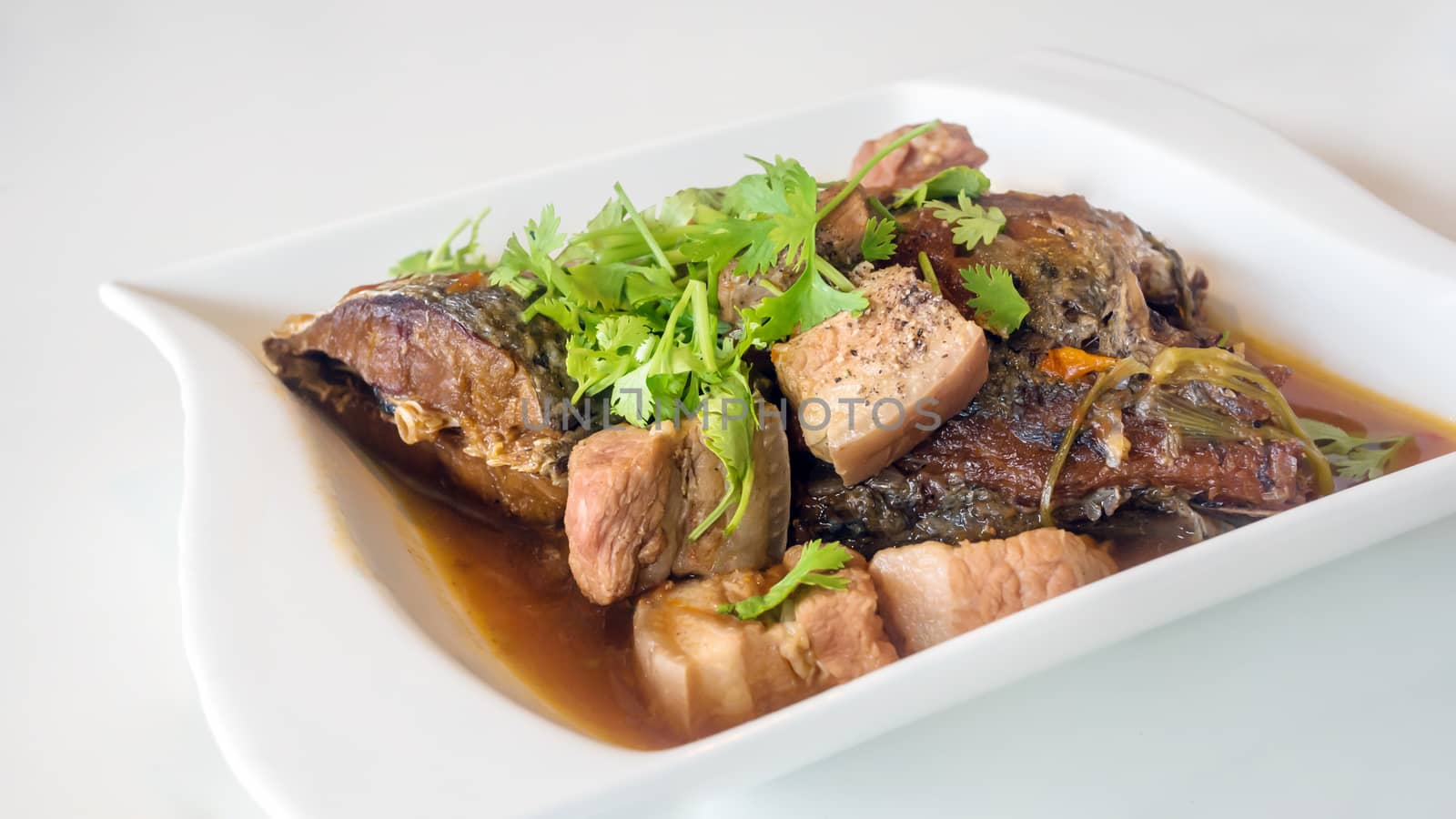 stewed pork and fish with herb , vietnamese style food