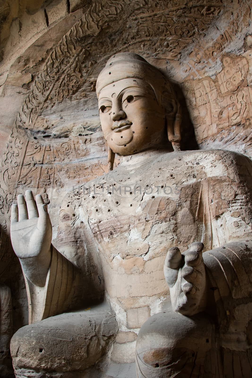 Giant stone Buddha scultpure in one of the main caves at the Yungang Grottos.