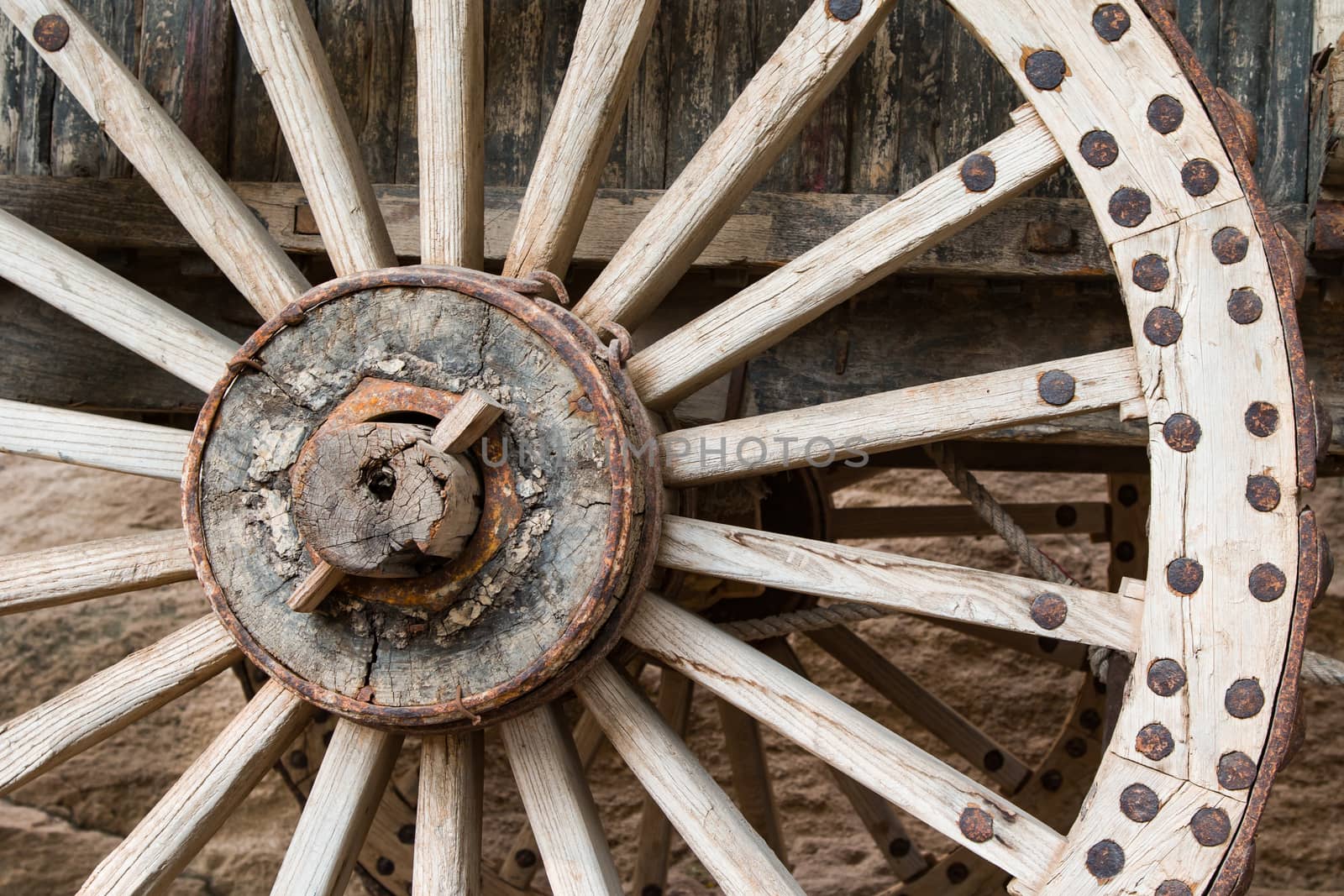 Close up of a Ming Dynasty wooden wheel on a horse cart.