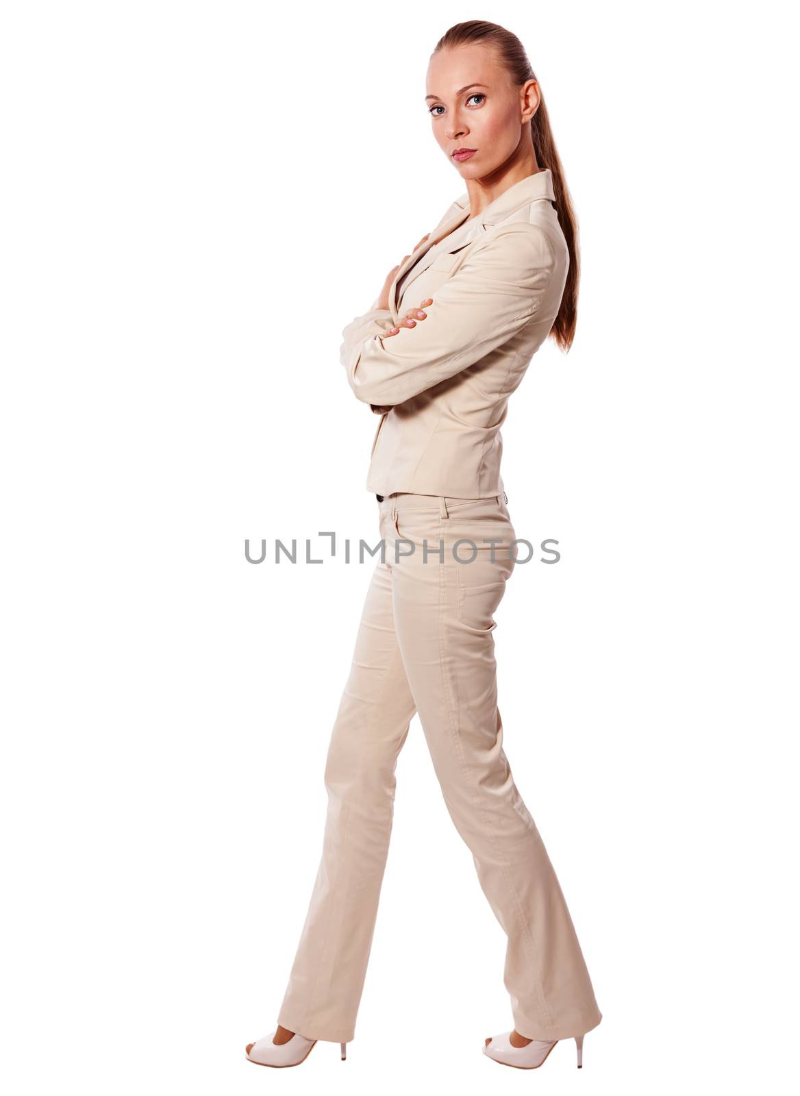 One Standing business woman wearing beige suit isolated on white