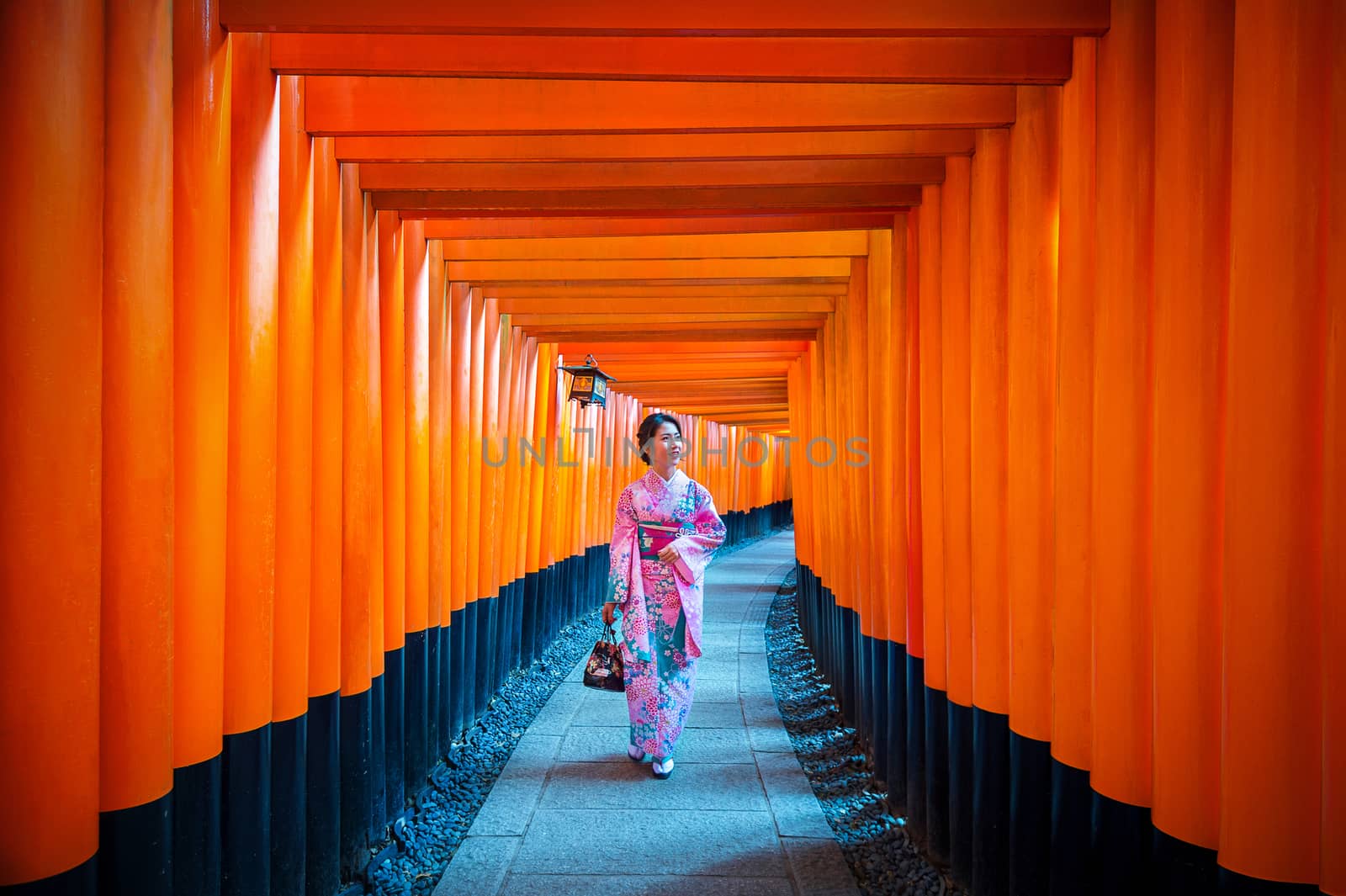 Asian women in traditional japanese kimonos at Fushimi Inari Shrine in Kyoto, Japan. by gutarphotoghaphy