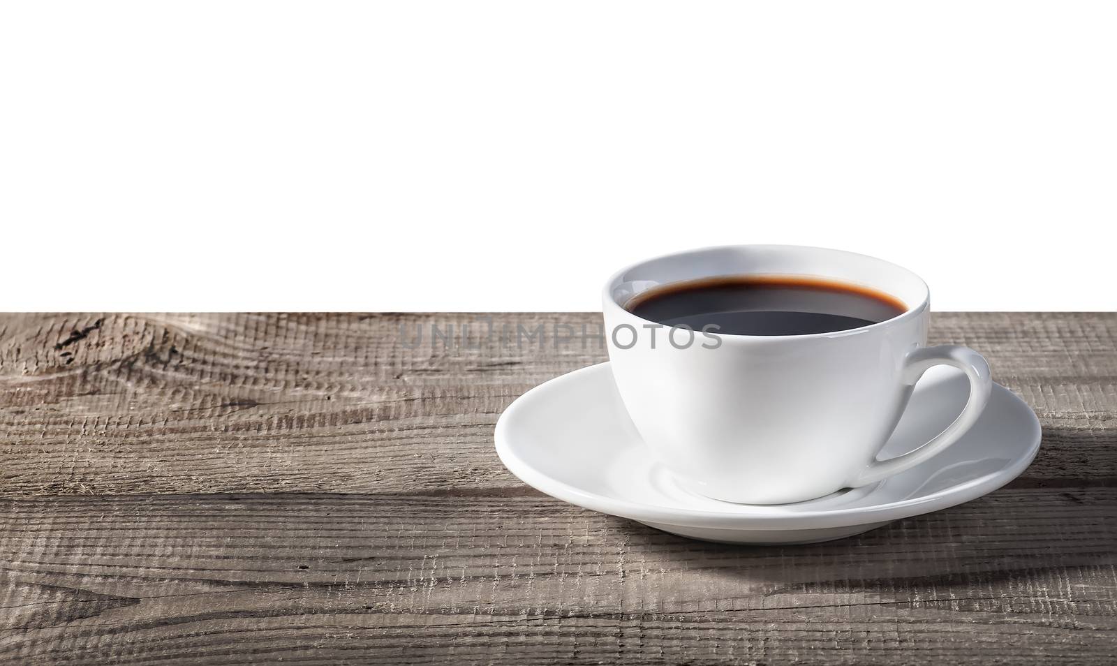 Cup of coffee on a wooden table isolated on white background